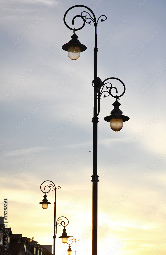 The retro-styled lamppost on the street of Warsaw, Poland The retro-styled lamppost on the street of Warsaw, Poland