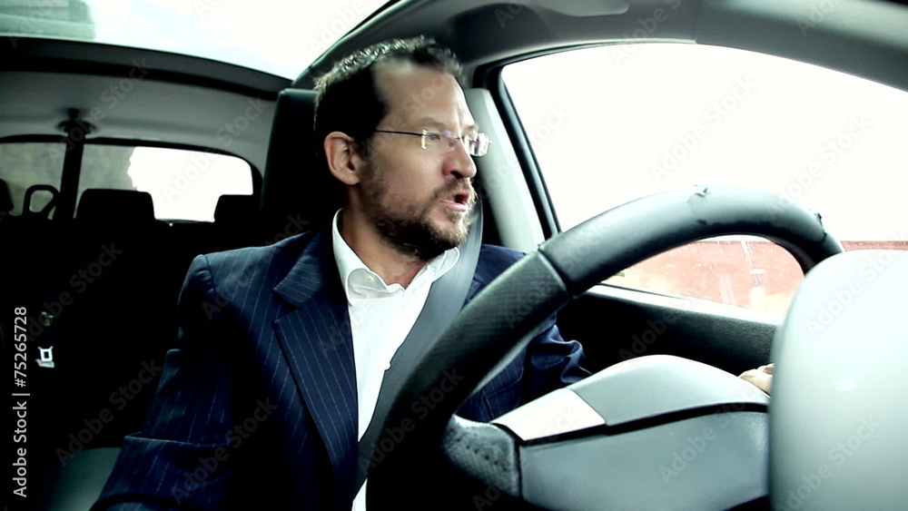 Angry business man shouting stock in traffic Angry business man shouting stock in traffic