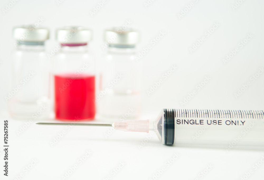 Disposable syringe and injection vials background Disposable syringe and injection vials background