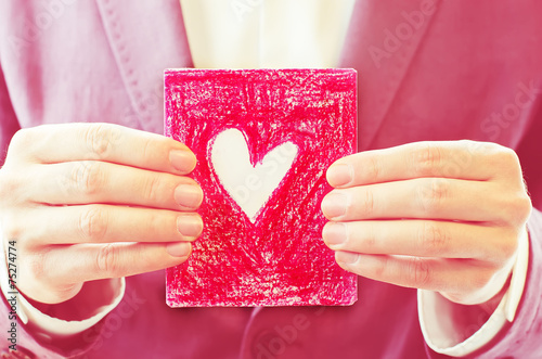 male hand holding a card