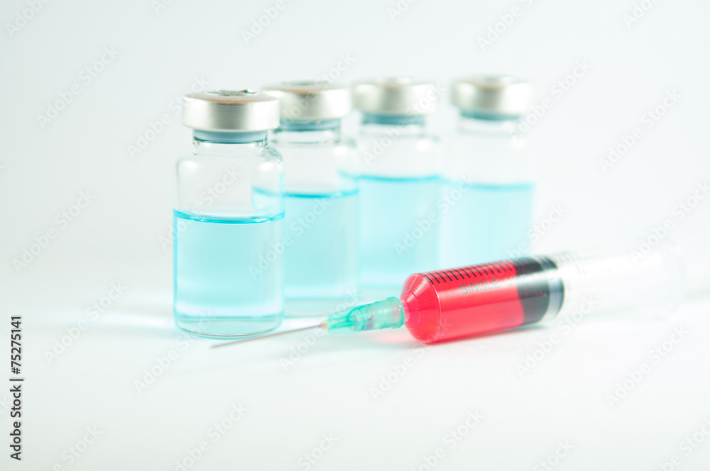 Red liquid in injection syringe and vials Red liquid in injection syringe and vials