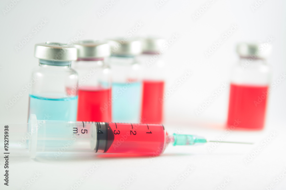 Disposable syringe and injection vial background Disposable syringe and injection vial background