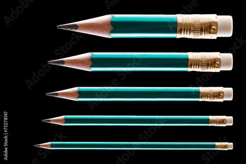 Five pencils on black