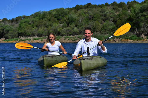 Couple Kayaking on lake