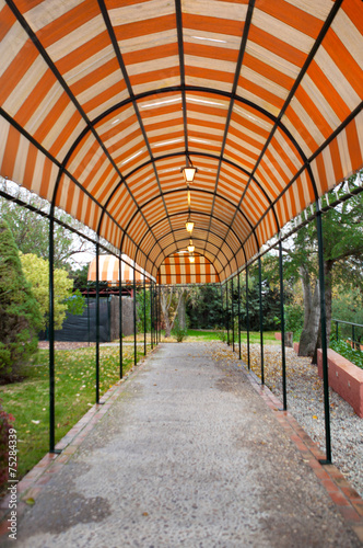 Covered pathway with lanterns