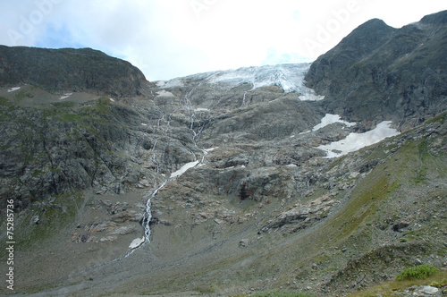 Rocks and glacier in Alps in Switzerland photo