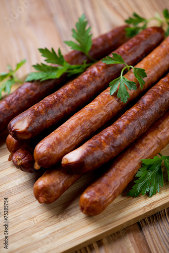 Sausages with parsley, close-up, vertical shot