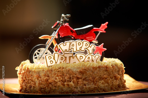 Wall Mural close up Birthday cake decorated with motorcycle and red stars