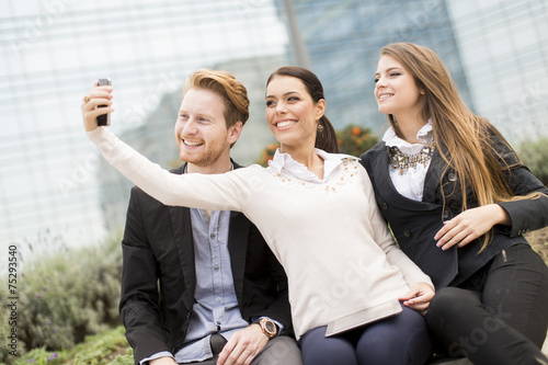 Young people taking photo w...