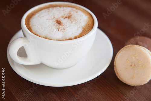 Cappuccino cup with coffee beans