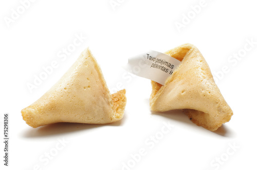 Open fortune cookie with phrase of wisdom inside