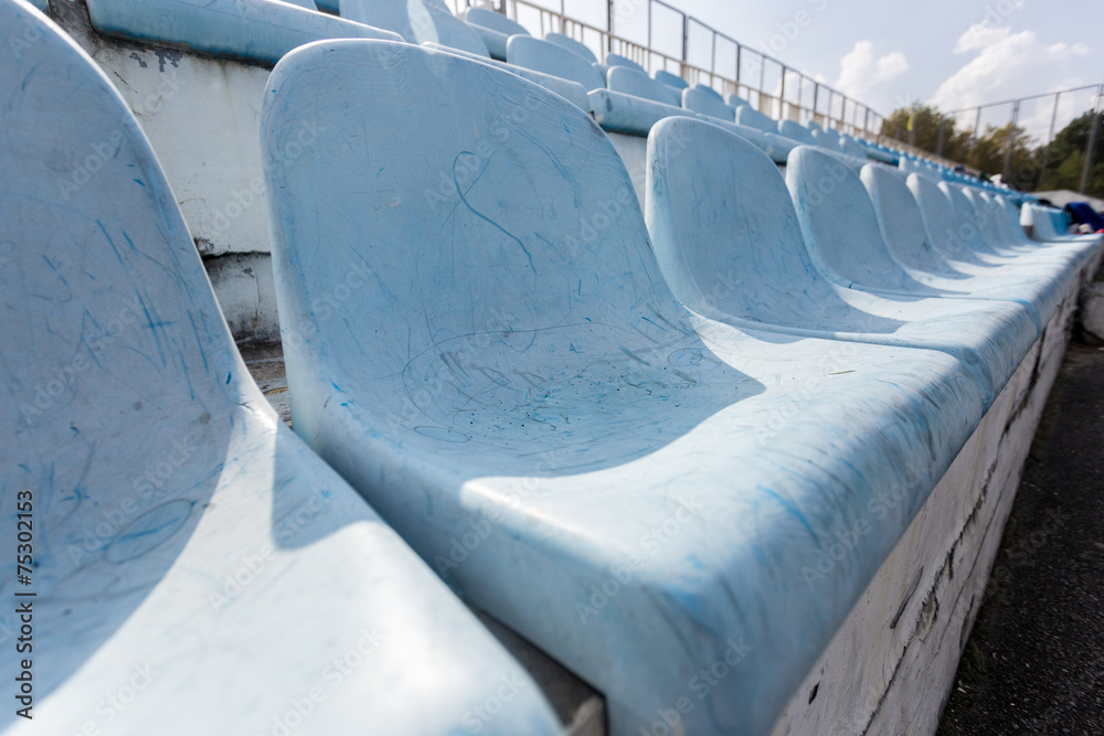 Fototapeta premium rows of old plastic seats on empty stadium