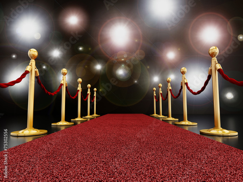 Red carpet at night with flashlights