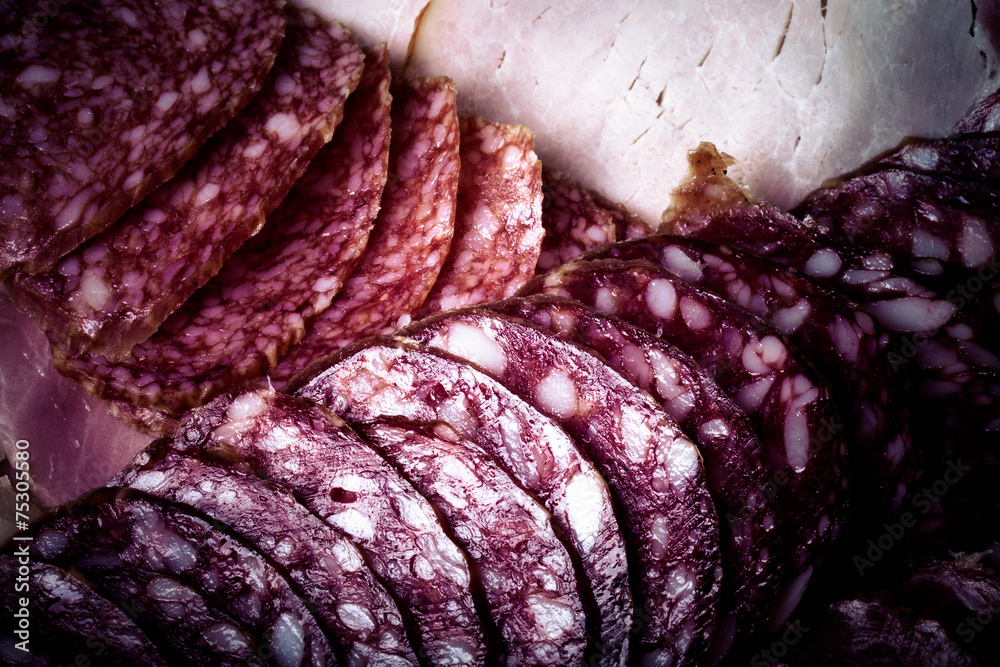 Fototapeta premium The background - detail of sliced salami