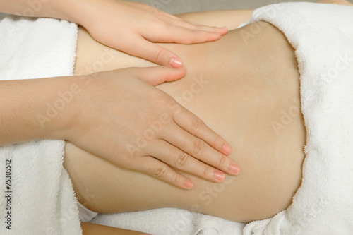 Woman having massage of body in the spa salon