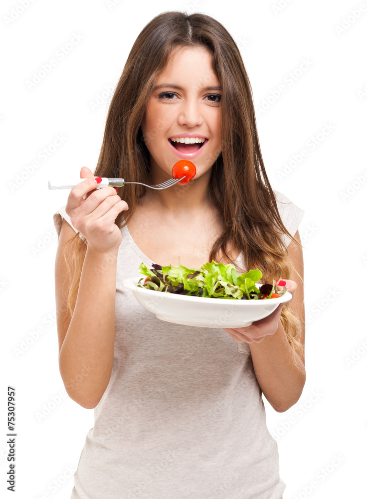 Young woman eating a healthy salad Young woman eating a healthy salad