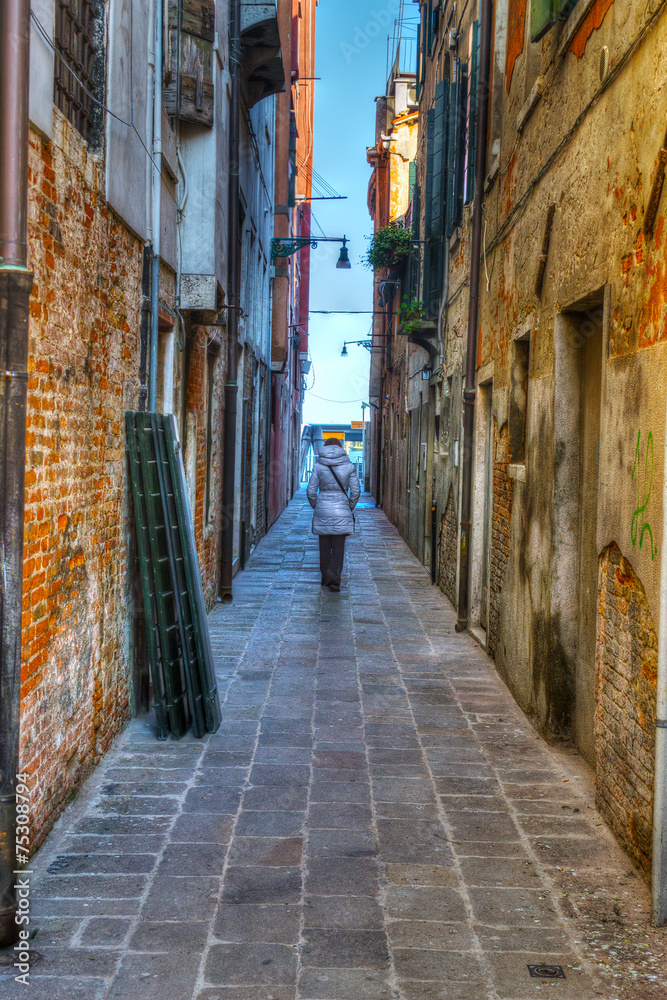 woman walking in an old backstreet