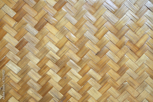Wooden wall made from bamboo and rattan for web background