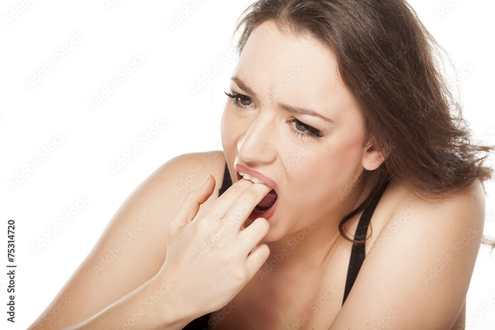 disgusted woman puts her fingers in her mouth disgusted woman puts her fingers in her mouth