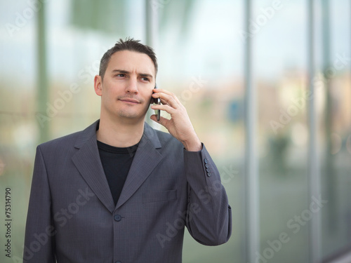 Portrait of businessman talking on his mobile phone