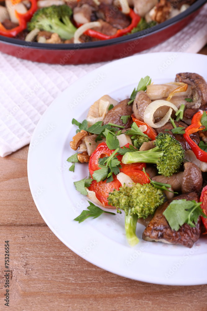 Braised wild mushrooms with vegetables and spices in pan and Braised wild mushrooms with vegetables and spices in pan and