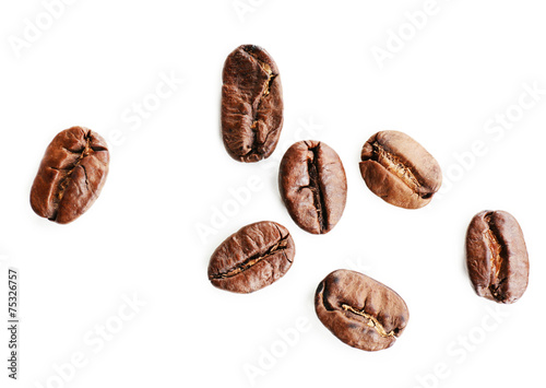 Coffee beans on white table, close-up