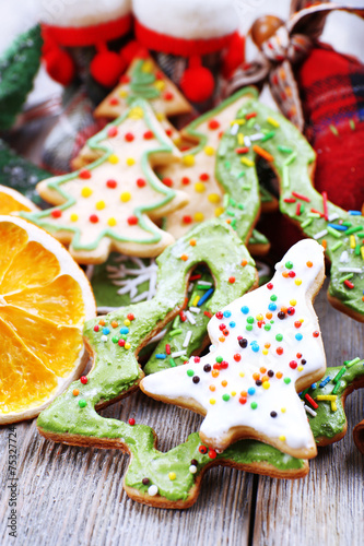Gingerbread cookies with slices of orange, cinnamon and star