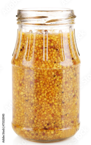 Dijon Mustard in glass jar isolated on white