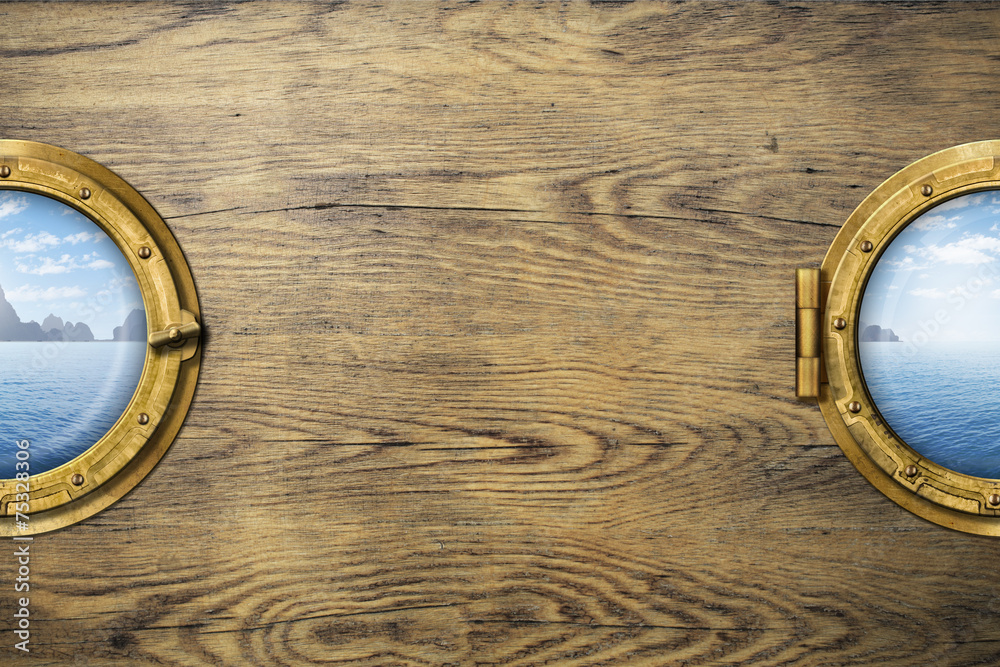 Obraz premium Two ship windows or portholes with tropical sea or ocean island