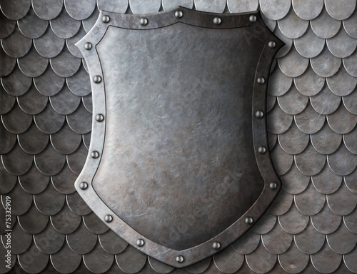 Fotografia old medieval coat of arms shield over scales armour background