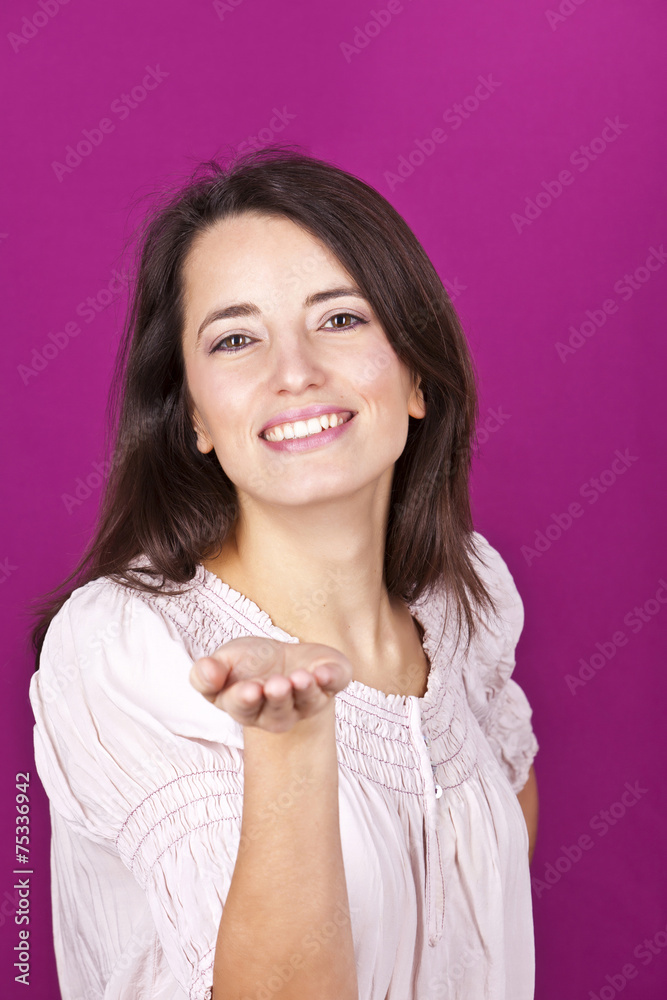 Beautiful and cheerful woman with open hand palm Beautiful and cheerful woman with open hand palm