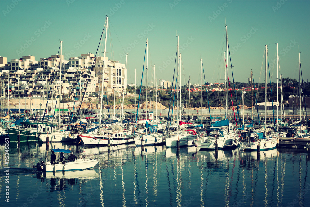 romantic marina with yachts. retro filtered image  