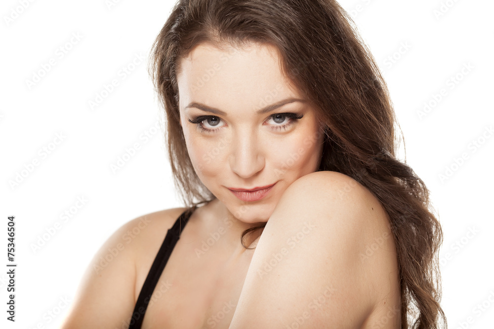 young happy woman with a seductive look on a white background young happy woman with a seductive look on a white background