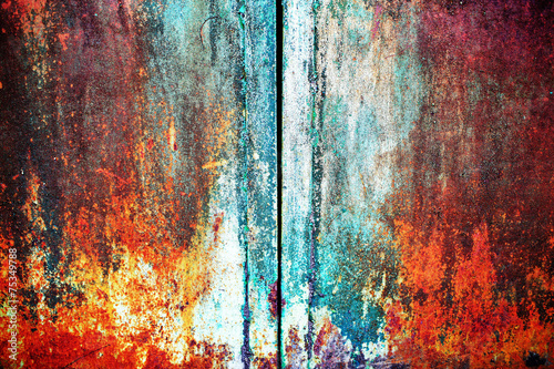 rusty metal with old cracked paint of different colors © andrii kornev