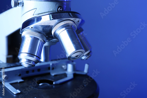 Microscope on color background, close-up