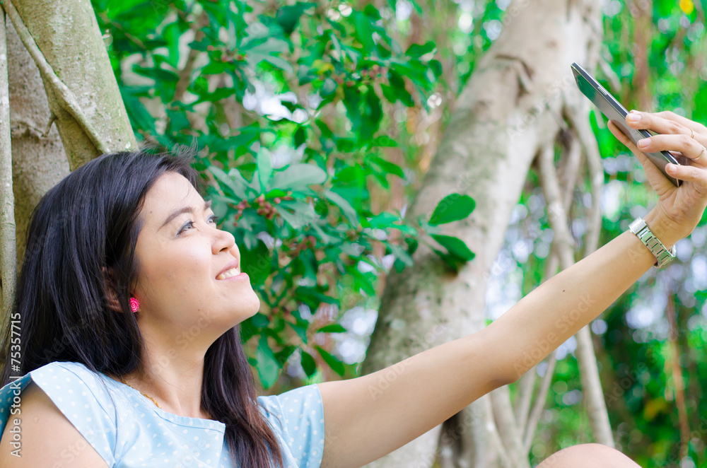 Woman take a picture using mobile phone selfie Woman take a picture using mobile phone selfie