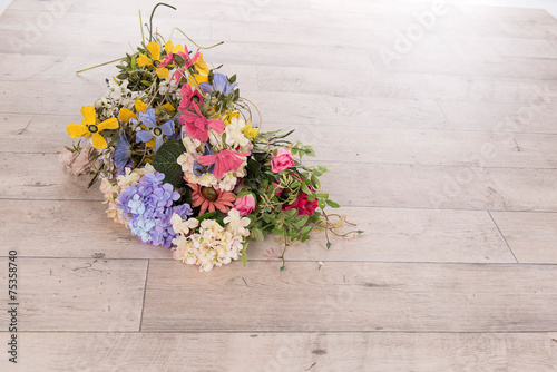 Flowers on a wooden floor
