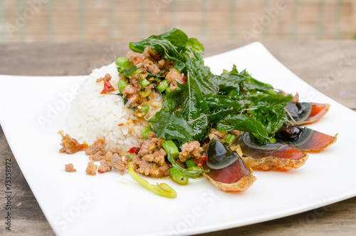 Fried basil with pork and preserved egg