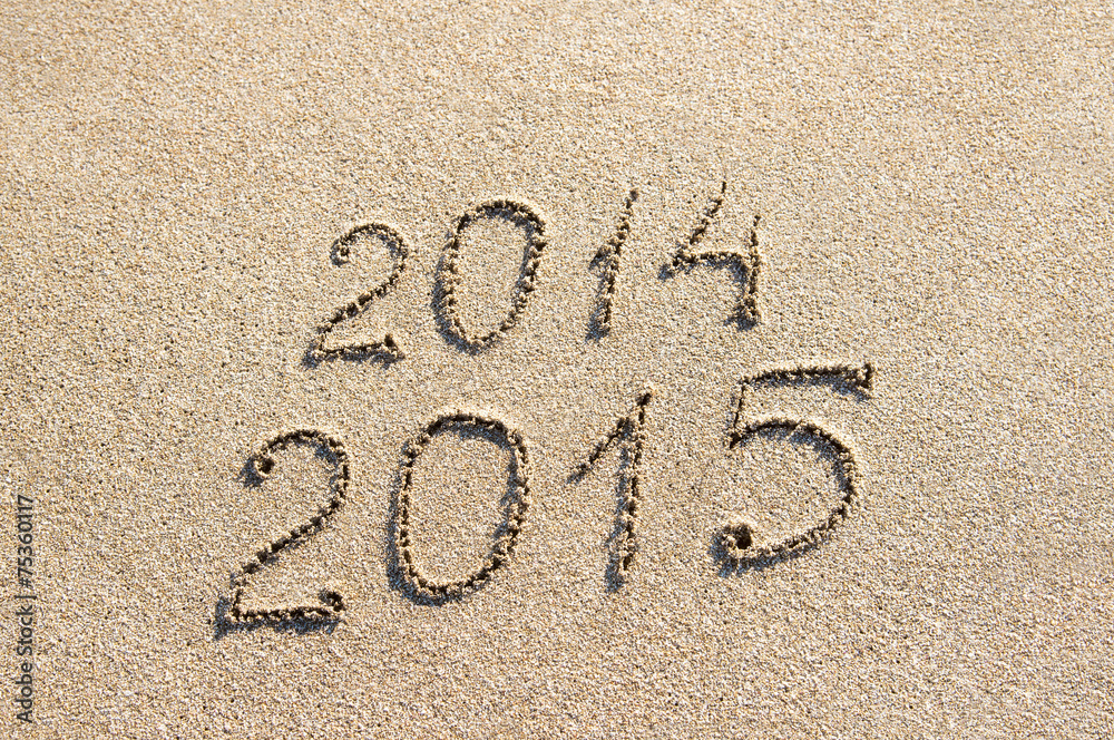 Fototapeta premium New Year 2015 season is coming instead 2014 concept at beach san