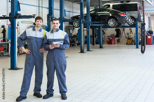 Two man mechanics working