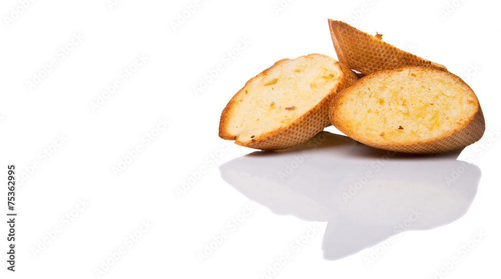 Homemade garlic bread of French baguette over white background Homemade garlic bread of French baguette over white background