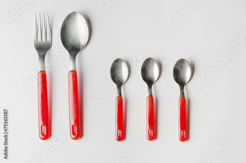 family of fork, spoon and three teaspoons