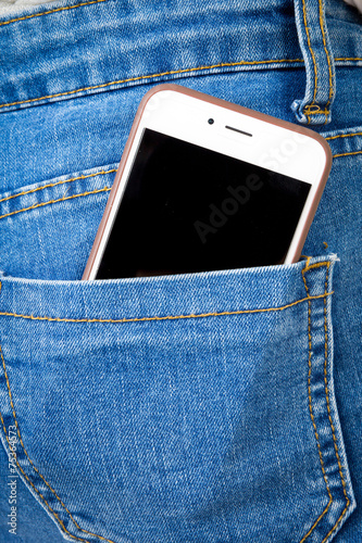 Cell phone in back pocket of girl's jeans