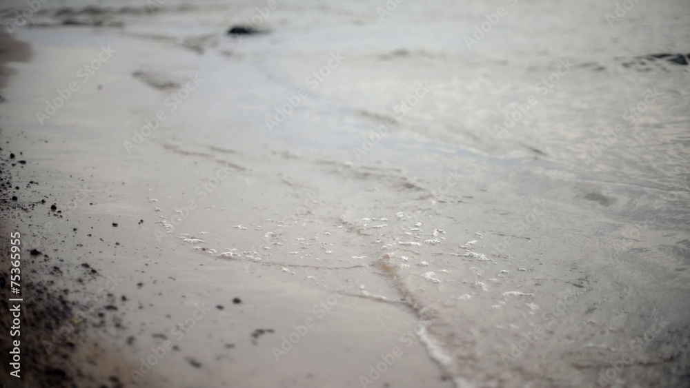waves crushing on the beach sand waves crushing on the beach sand
