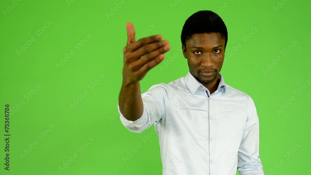 young handsome black man invites - green screen