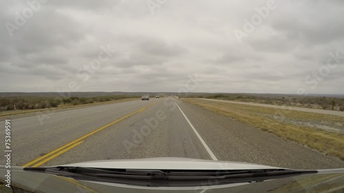 Car driving through Texas in the winter photo