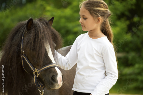 Fototapeta child and pony