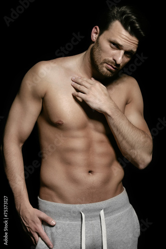 Young handsome man with muscular body