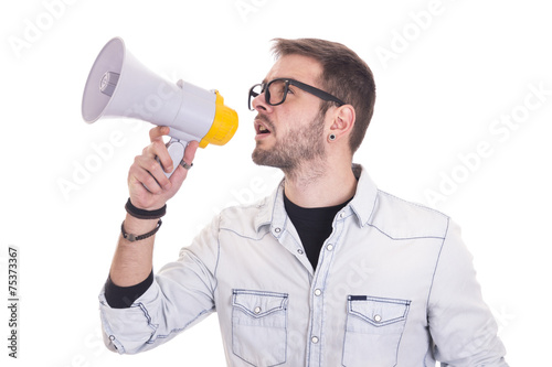 Portrait of young man handsome shouting using megaphone
