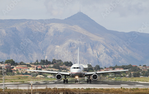 Plane on runway and mountains. Corfu, Greece